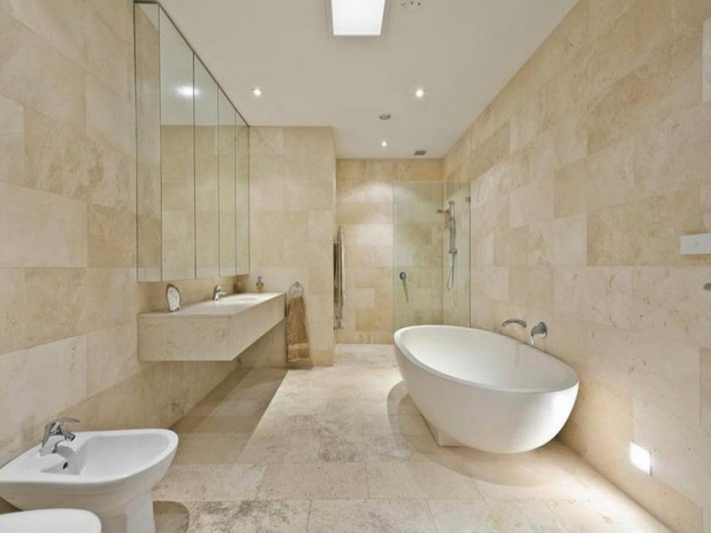ivory travertine filled and honed bathroom tiles