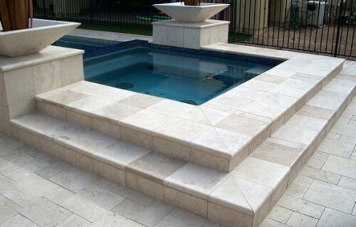 ivory travertine unfilled and tumbled outdoor area pool pavers and coping