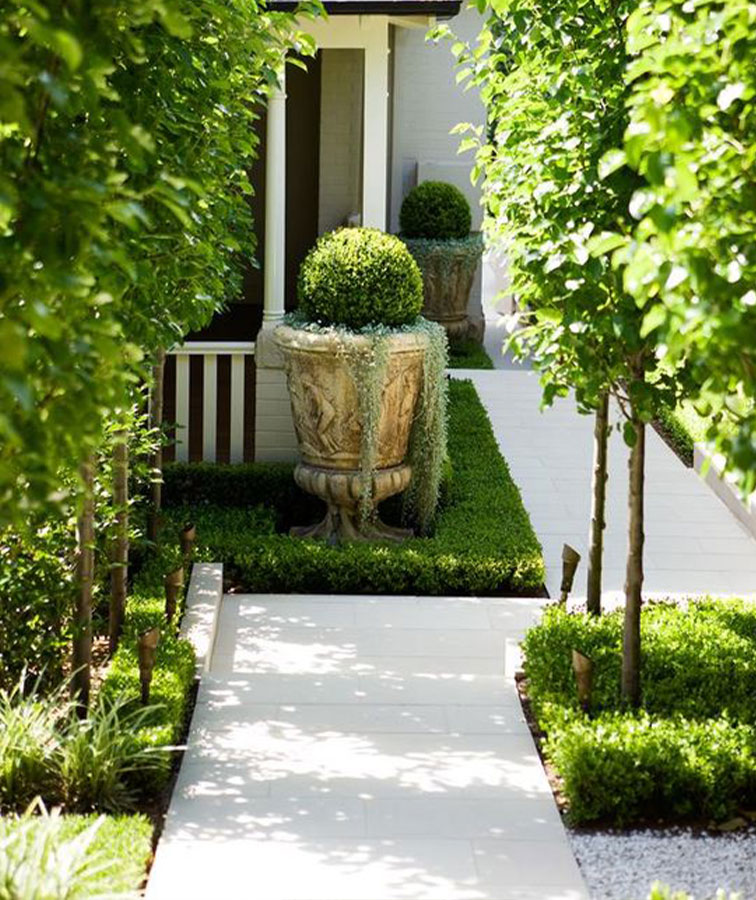 White limestone outdoor pavers that form a path.