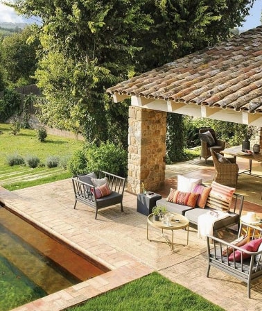 Outdoor tiles, a verandah and a house table.